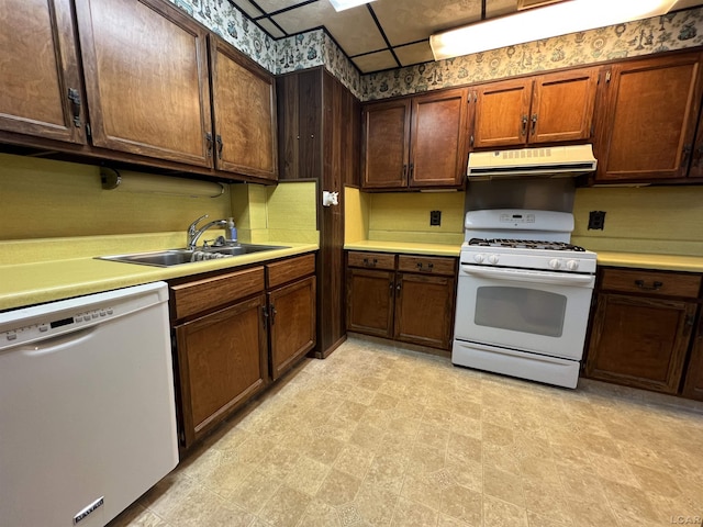 kitchen featuring sink and white appliances