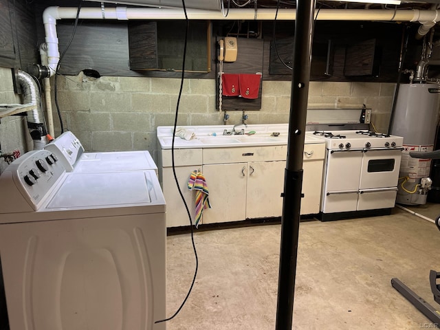 clothes washing area with washing machine and dryer, cabinets, sink, and gas water heater