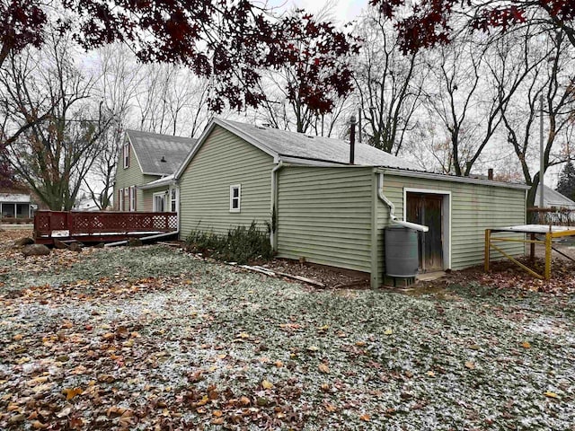 view of side of property featuring a deck