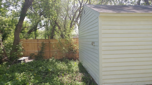 view of side of property with a shed