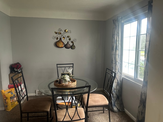 view of carpeted dining area