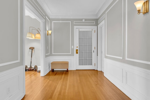 interior space featuring hardwood / wood-style flooring and ornamental molding