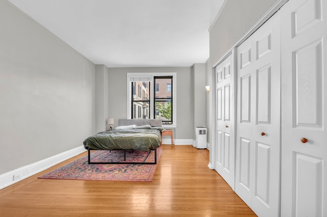 bedroom with light hardwood / wood-style floors