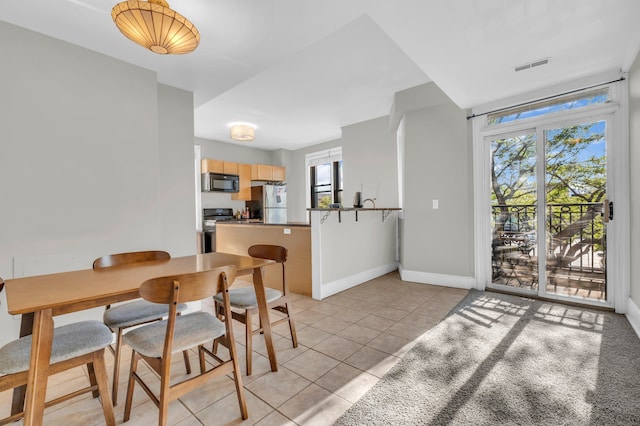 view of tiled dining space