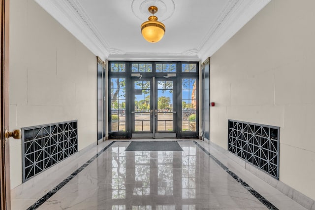 foyer entrance with french doors, expansive windows, and ornamental molding