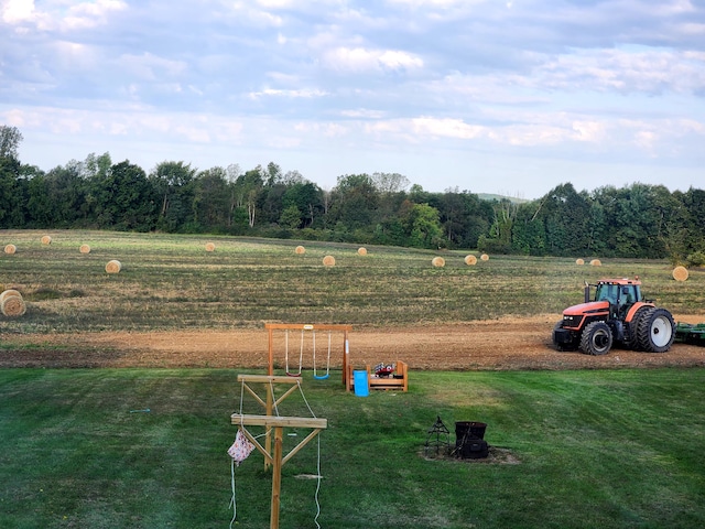 exterior space with a rural view and a lawn