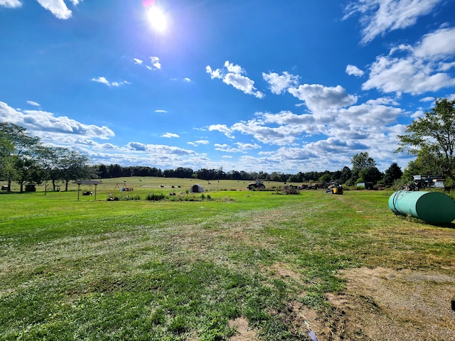 view of yard with a rural view