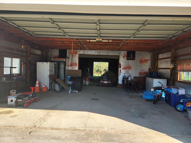 garage featuring white fridge