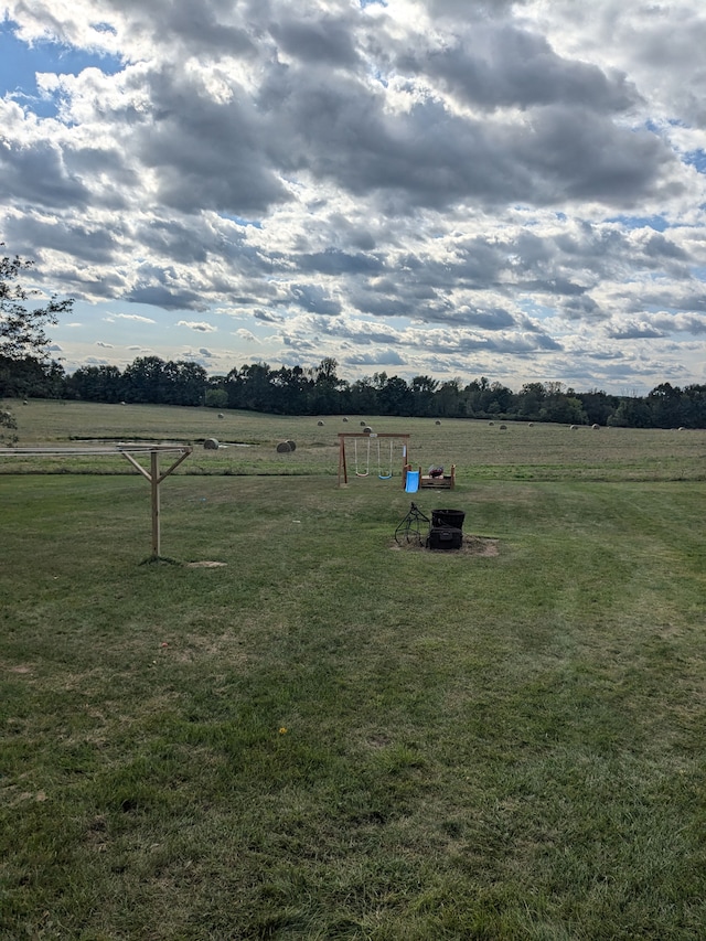 view of yard with a rural view