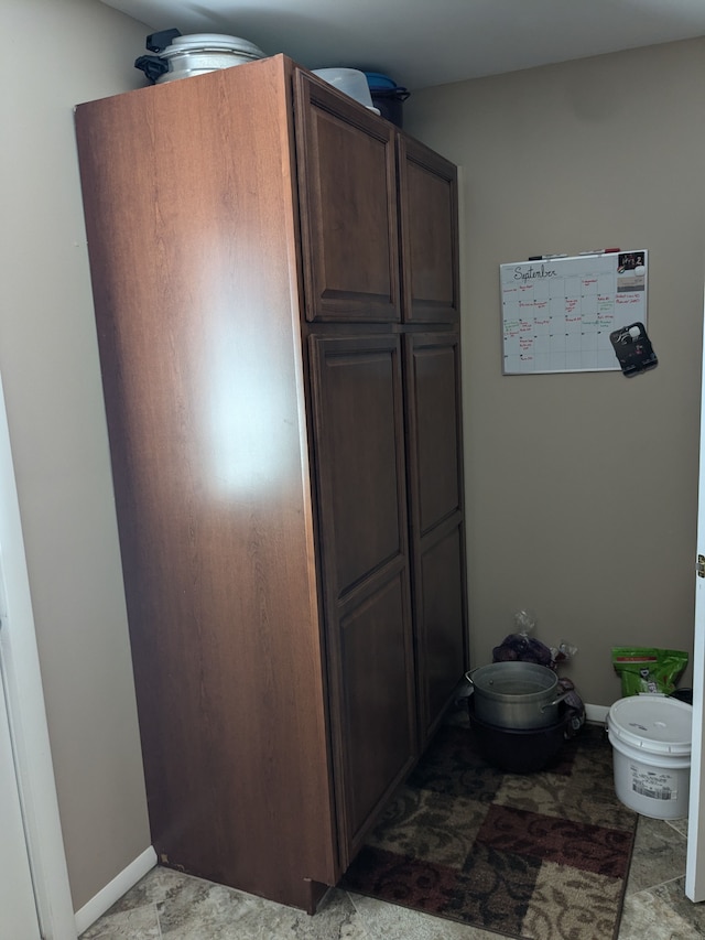 kitchen featuring dark brown cabinets