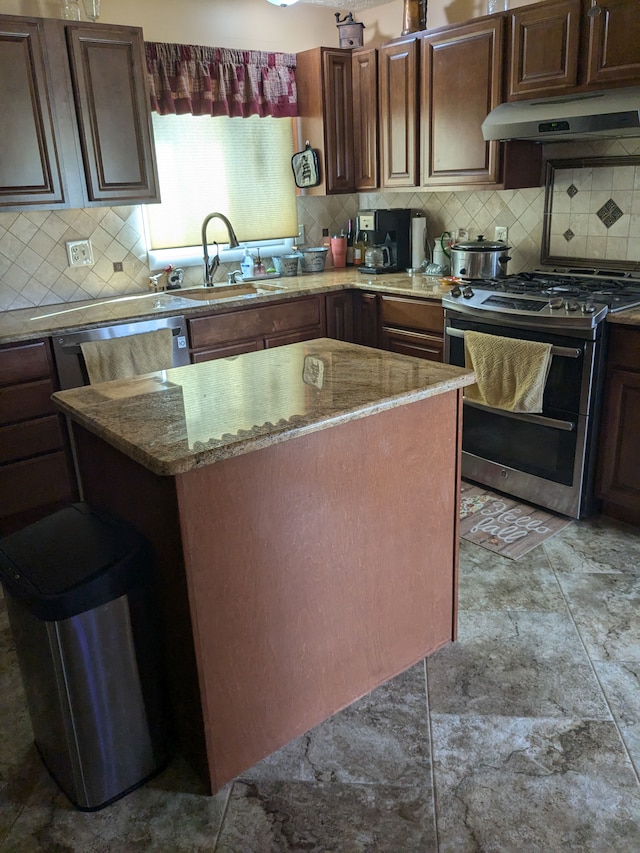 kitchen with backsplash, sink, light stone countertops, and stainless steel appliances