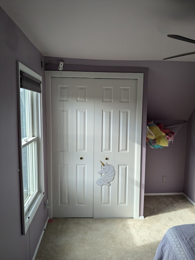 bedroom with a closet and carpet floors