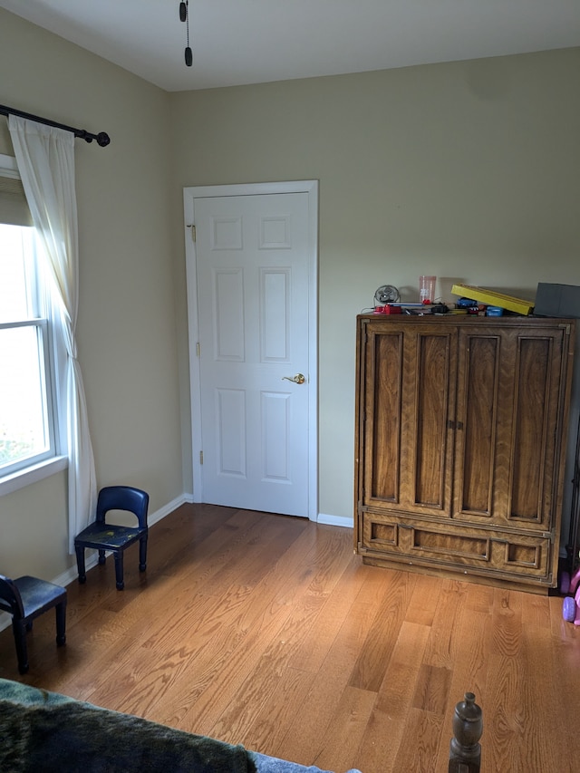 bedroom with light hardwood / wood-style floors