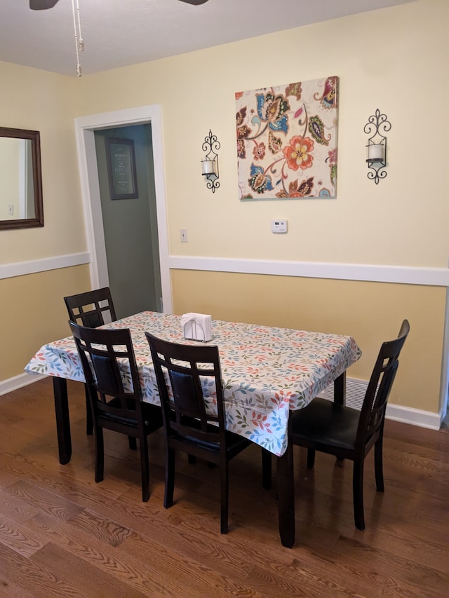 dining room with dark hardwood / wood-style floors