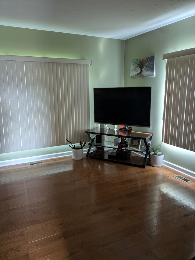 living room with wood walls and hardwood / wood-style flooring