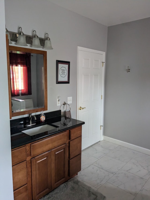 bathroom with vanity and toilet