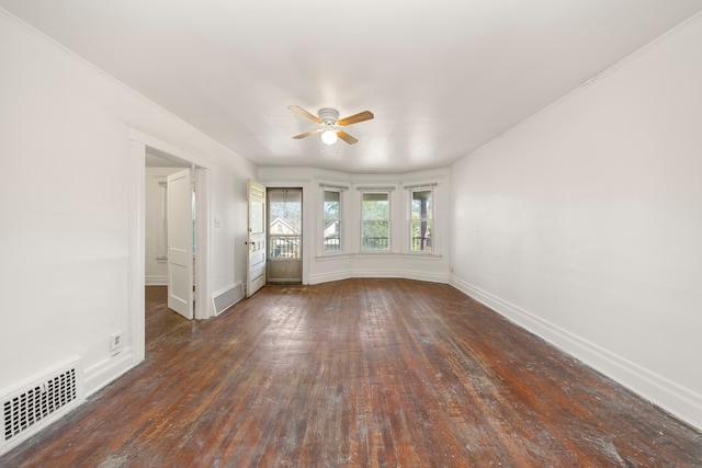 unfurnished living room with ceiling fan, dark hardwood / wood-style flooring, and ornamental molding