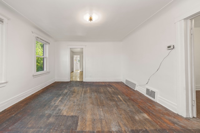 spare room with dark hardwood / wood-style floors