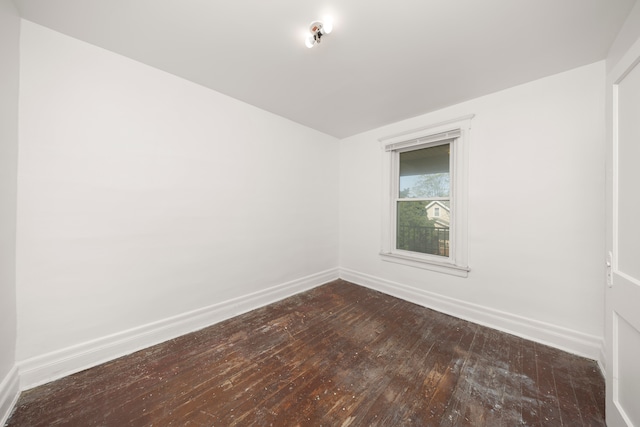 empty room with hardwood / wood-style floors