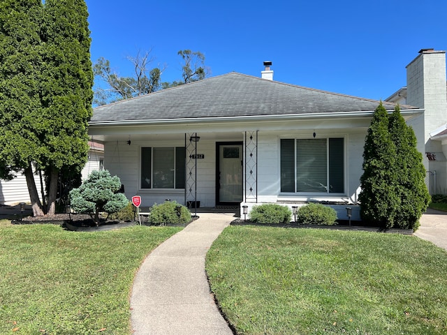 view of front of home with a front lawn and a porch