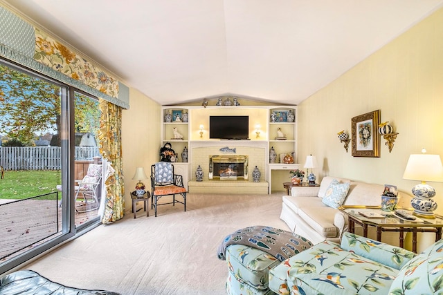 carpeted living room featuring a fireplace and vaulted ceiling