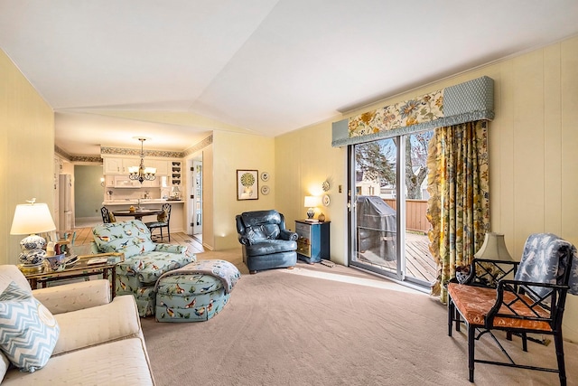 carpeted living room with vaulted ceiling and a notable chandelier