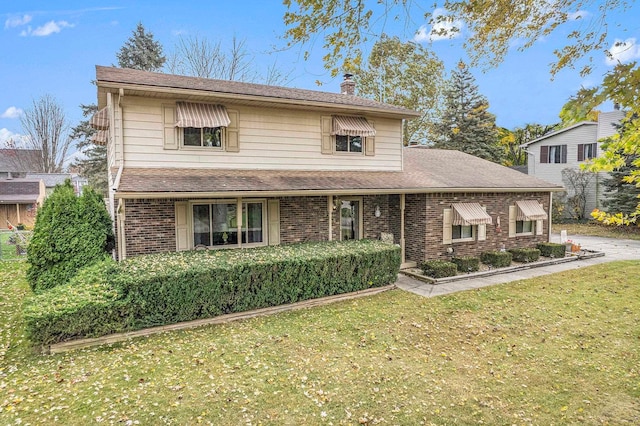 front facade featuring a front lawn