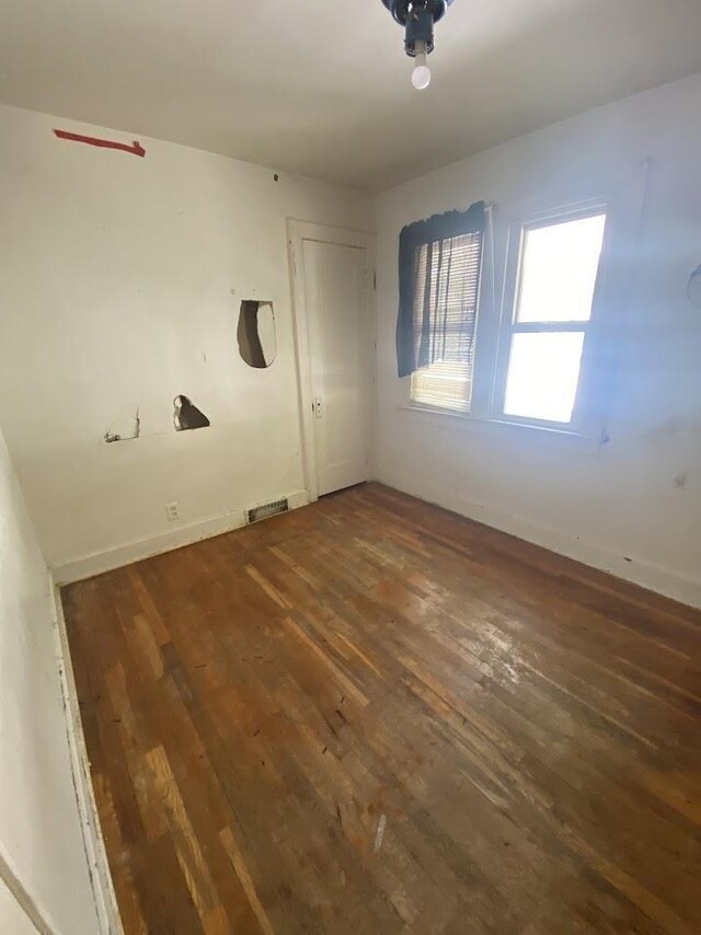 836 Victoria Ave, Flint, MI 48507 - unfurnished room with hardwood / wood-style flooring and baseboards