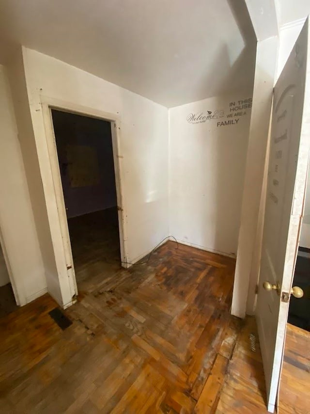 unfurnished room with dark hardwood / wood-style flooring