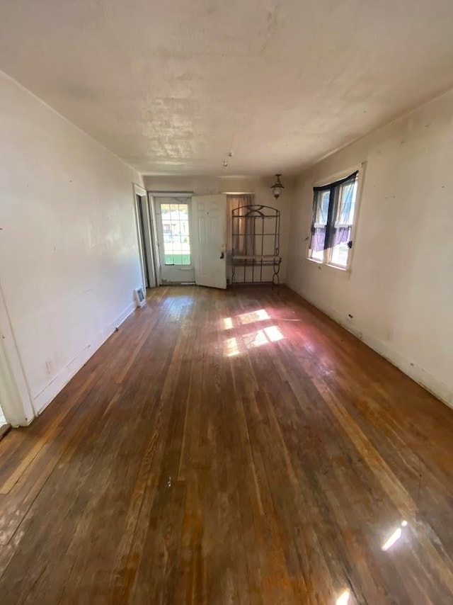 empty room featuring dark hardwood / wood-style flooring