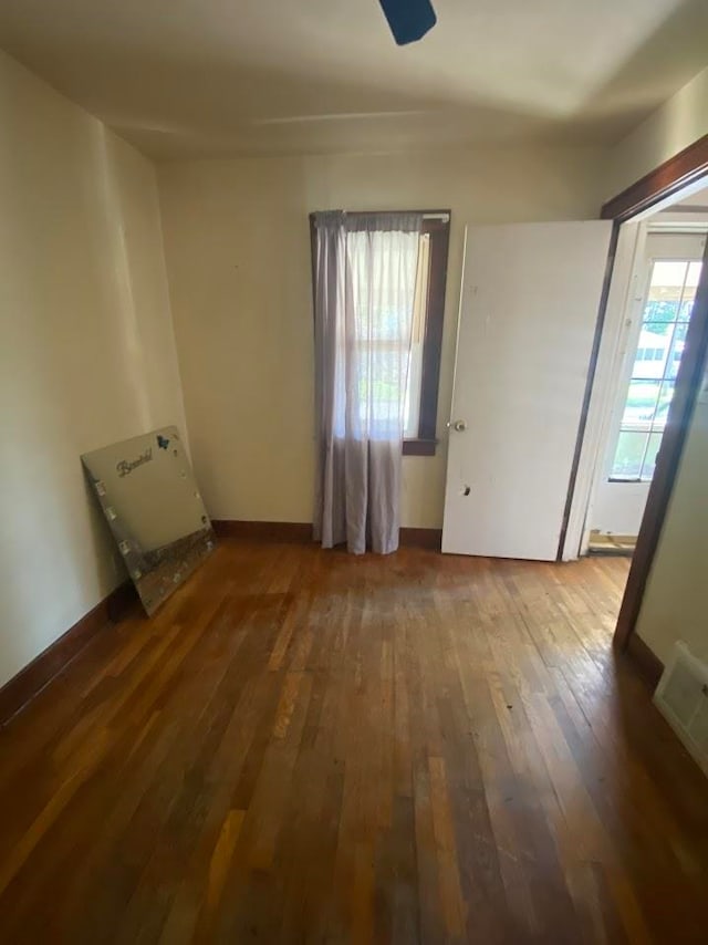 spare room featuring dark hardwood / wood-style flooring