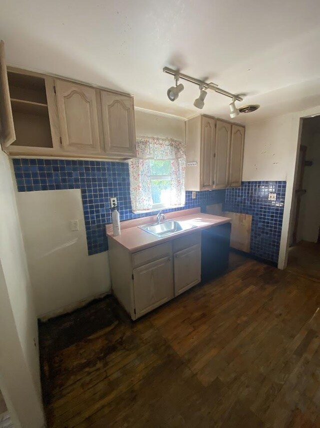 836 Victoria Ave, Flint, MI 48507 - kitchen with tile walls, a sink, dark wood-style floors, wainscoting, and light countertops