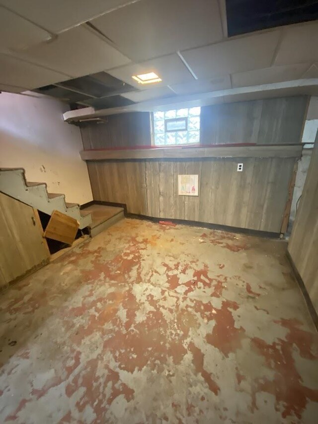 836 Victoria Ave, Flint, MI 48507 - basement with wood walls and stairway