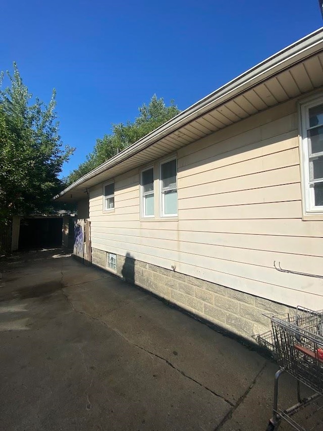 view of property exterior featuring a patio