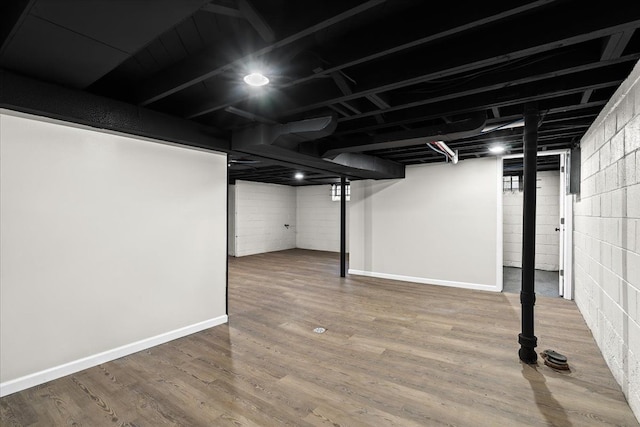 basement featuring hardwood / wood-style floors