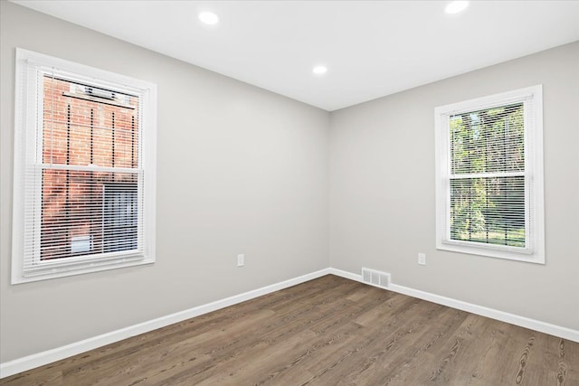 unfurnished room featuring hardwood / wood-style floors