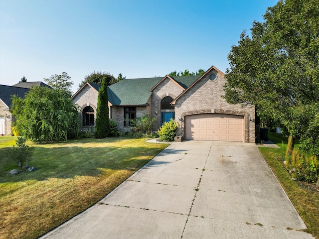 french country style house with a garage and a front yard