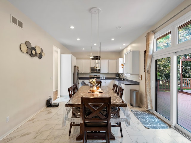 dining area featuring sink