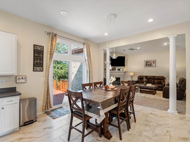 dining room with decorative columns