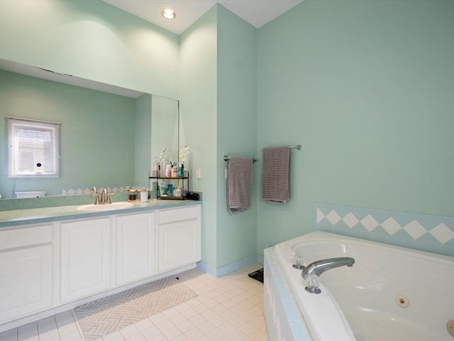 bathroom featuring vanity, a relaxing tiled tub, and tile patterned floors