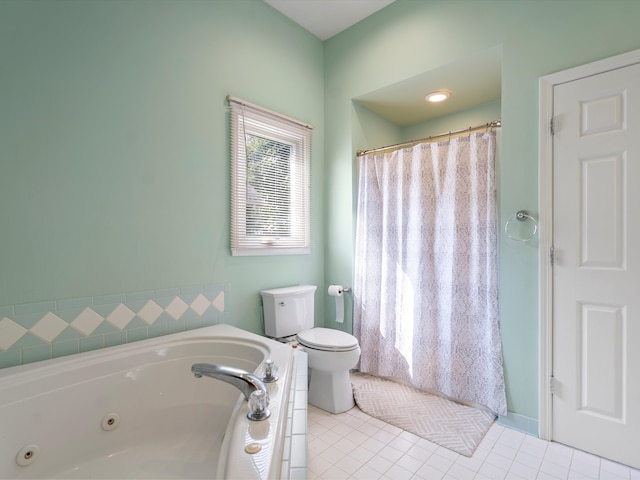 bathroom with tile patterned floors, toilet, and a tub