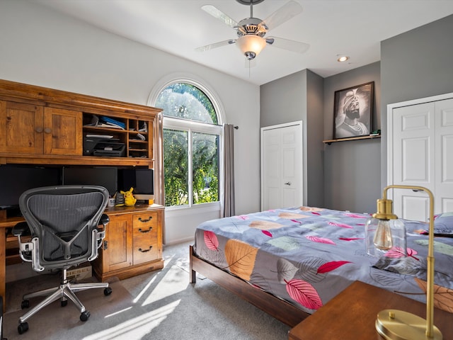 bedroom featuring ceiling fan and light carpet