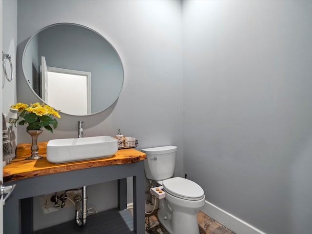 bathroom featuring toilet and sink