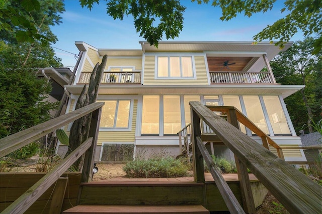 876 S Beach, Pentwater, MI 49449 - rear view of property with a balcony and a sunroom