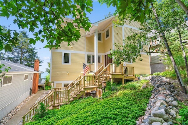 876 S Beach, Pentwater, MI 49449 - rear view of house with stairs and a deck
