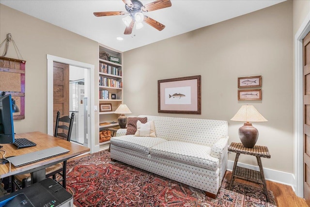 876 S Beach, Pentwater, MI 49449 - home office featuring ceiling fan, wood finished floors, built in shelves, baseboards, and recessed lighting