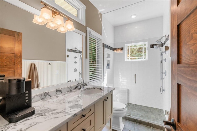 876 S Beach, Pentwater, MI 49449 - full bathroom with a stall shower, toilet, a chandelier, and vanity