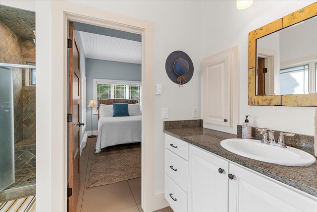 876 S Beach, Pentwater, MI 49449 - ensuite bathroom featuring a stall shower, tile patterned flooring, and vanity
