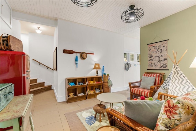 876 S Beach, Pentwater, MI 49449 - living area with light tile patterned floors, stairs, baseboards, and wooden ceiling