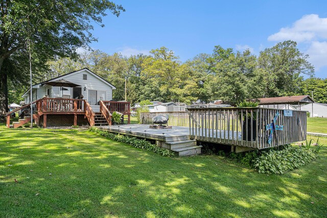 76 Sundago Park St, Hastings, MI 49058 - view of green lawn with a deck